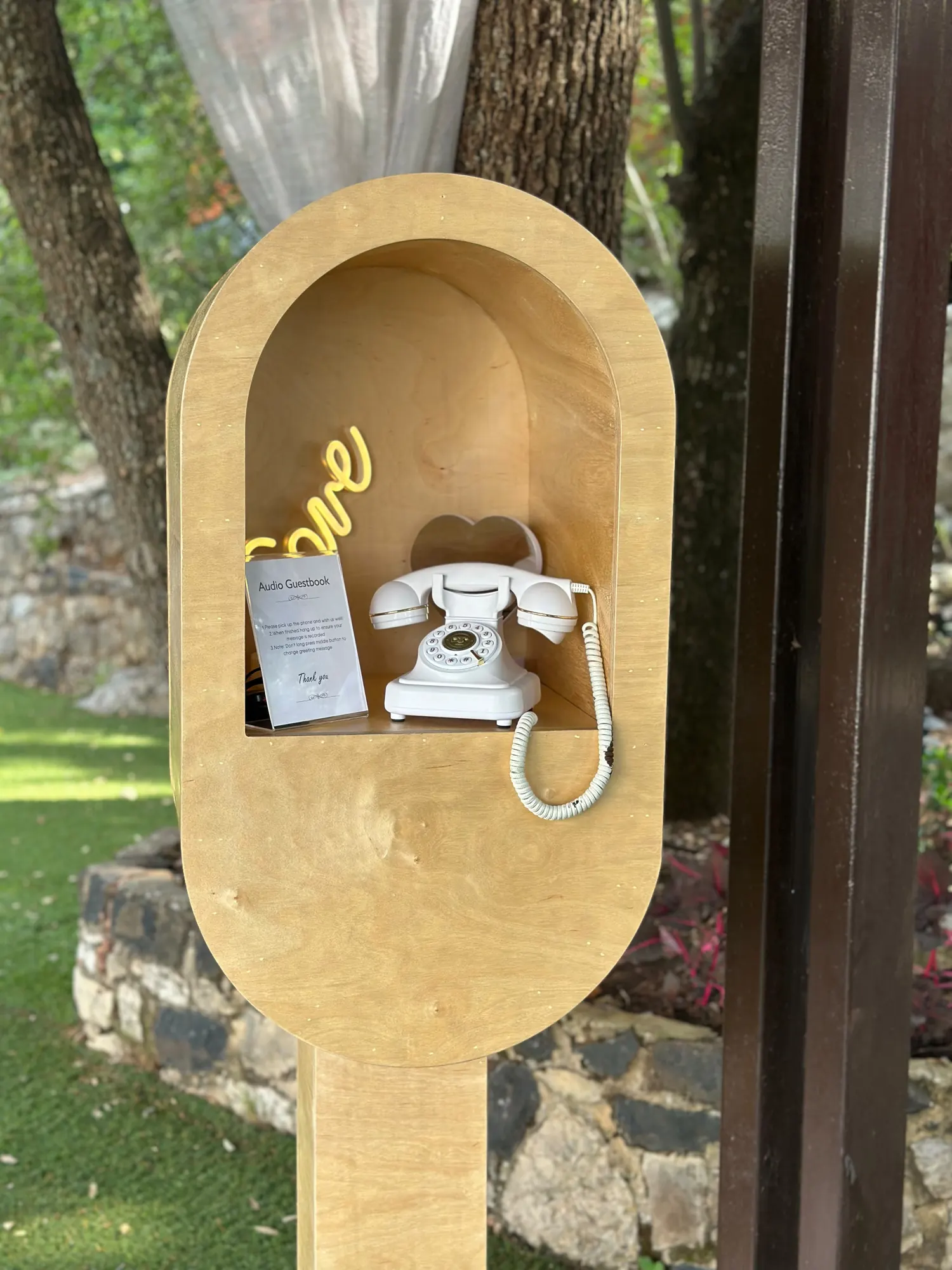 The Leave a Message booth set up in a garden